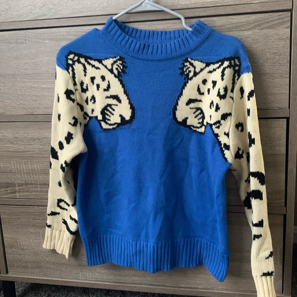 Leopard sleeve sweater will be donated 5/2024